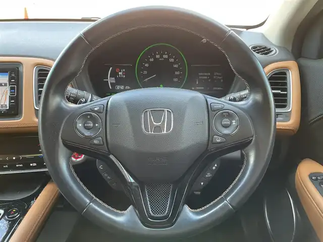 ホンダ ヴェゼル ハイブリッド Z ホンダセンシング 大阪府 2020(令2)年 5.5万km ミッドナイトブルービームM ホンダセンシング/　・追従式クルコン/　・車線逸脱/　・衝突軽減ブレーキ/純正SDナビゲーション/　Bluetooth/CD/DVD/フルセグ/FM/AM/バックカメラ/ハーフレザー/前席シートヒーター/純正17インチアルミ/革巻ステアリング/ステアリングシフト/ビルトインETC/プッシュスタート/電動パーキング/ブレーキホールド