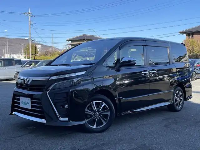 トヨタ ヴォクシー ZS 煌Ⅱ 山梨県 2019(令1)年 5.5万km イナズマスパーキングブラックガラスフレーク 純正9型ナビ/・Bluetooth/CD/DVD/・フルセグTV/パワースライドドア(両側)/バックカメラ/ビルトインETC2.0/ドライブレコーダー/後席ディスプレイ/クルーズコントロール/インテリジェントクリアランスソナー/セーフティセンス/・プリクラッシュセーフティシステム/・レーンディパーチャーアラート/・オートマチックハイビーム/・先行車発進告知機能/LEDヘッドランプ/オートライト/デュアルオートエアコン/本革巻きステアリング/ステアリングスイッチ/純正16インチアルミホイール/スマートキー/スマートエントリー/プッシュスタートシステム/禁煙車