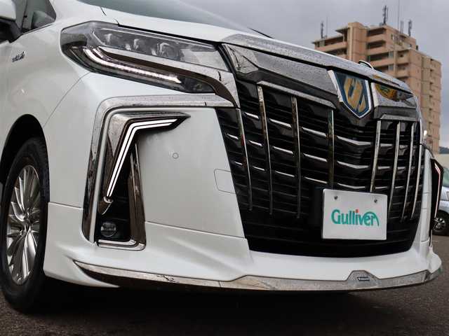 トヨタ アルファードハイブリット S タイプゴールド 道東・釧路十勝 2020(令2)年 5.8万km ホワイトパールクリスタルシャイン ワンオーナー /4WD /モデリスタエアロ /・シグネチャーイルミブレード（モデリスタ） /・フロントグリルカバー(モデリスタ) /純正ディスプレイオーディオ /・TV/BT/TVキャンセラー /バックカメラ/純正フリップダウンモニター /デジタルインナーミラー /両側パワースライドドア  / ToyotaSafetyS e n s e /・プリクラッシュセーフティ /・レーンキープア シ ス ト/・アダプティブハイビーム/・オートマチックハイビーム/・ロードサインアシスト/・クルーズコントロール/・先行車発進お知らせ/ブレーキホールド/クリアランスソナー/ブラインドスポットモニター/社外ドラレコ（前後）/ETC2.0