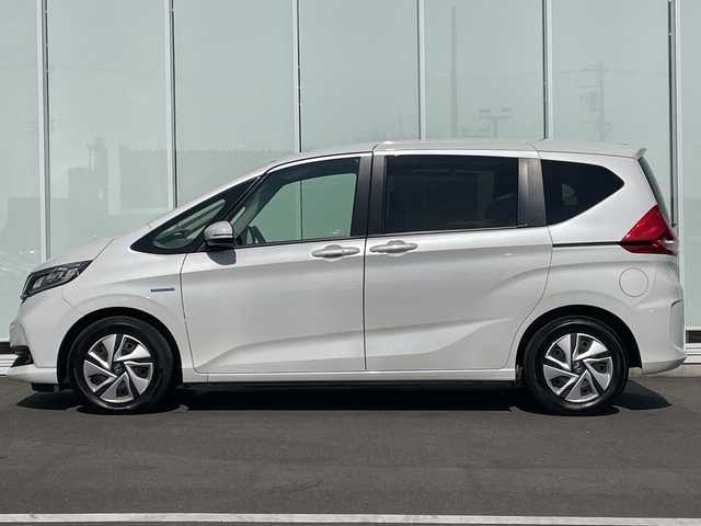 ホンダ フリード ハイブリット G ホンダセンシング 神奈川県 2020(令2)年 2.3万km プラチナホワイトパール 純正SDナビ /ワンセグＴＶ　/両側パワースライドドア /バックカメラ　/クルーズコントロール　/前席シートヒーター　/コーナーセンサー　/純正ドライブレコーダー　/ビルトインETC　/純正フロアマット/LED/取扱説明書/記録簿/保証書/衝突被害軽減システム