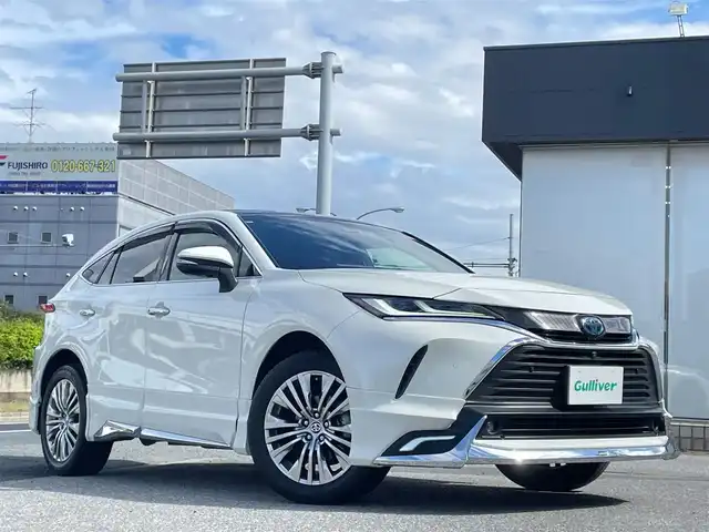 トヨタ ハリアー ハイブリッド Z レザーパッケージ 千葉県 2021(令3)年 3.1万km ホワイトパールクリスタルシャイン ワンオーナー/Zレザーパッケージ/4WD/パノラマルーフ/モデリスタエアロ（F/S/R）/マルチテレインモニター　OP/JBLプレミアムサウンド/12.3インチ純正ディスプレイオーディオ＋ナビ/・フルセグTV/BTオーディオ/ラジオ/黒革シート/シートメモリ付パワーシート/フロントシートベンチレーション/Toyota Safety Sense/・プリクラッシュセーフティ/・レーダークルーズコントロール/・オートマチックハイビーム/・レーントレーシングアシスト/ブラインドスポットモニター/デジタルインナーミラー/ステアリングヒーター/ビルトインETC2.0/クリアランスソナー/プッシュスタート/スマートキー/ワイドバイザー/純正19インチAW/LEDヘッドライト/保証書/取説/スペアキー