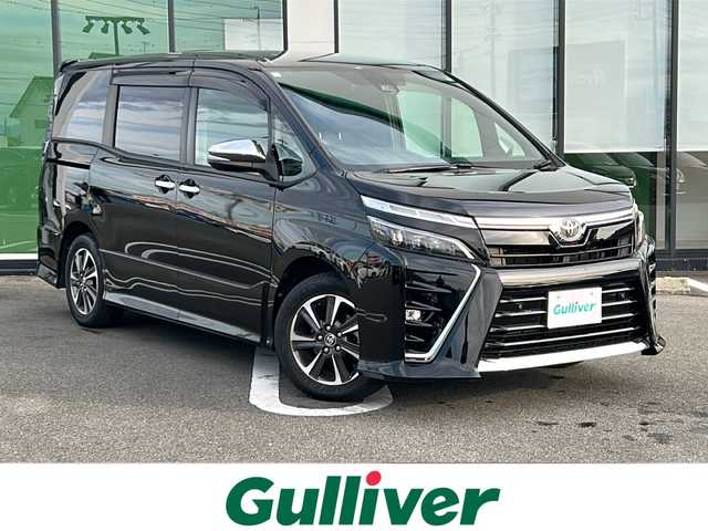 トヨタ ヴォクシー ZS 煌Ⅲ 岐阜県 2021(令3)年 5.9万km ブラック 登録時走行距離58312km/純正10インチナビ/フルセグＴＶ/バックカメラ/クルーズコントロール/両側パワースライドドア/コーナーセンサー/プッシュスタート/スマートキー/レーンキープアシスト/ＬＥＤヘッドライト/オートライト/禁煙車/ＥＴＣ/Bluetooth接続/純正アルミホイール/社外フロアマット/ハーフレザーシート/アイドリングストップ