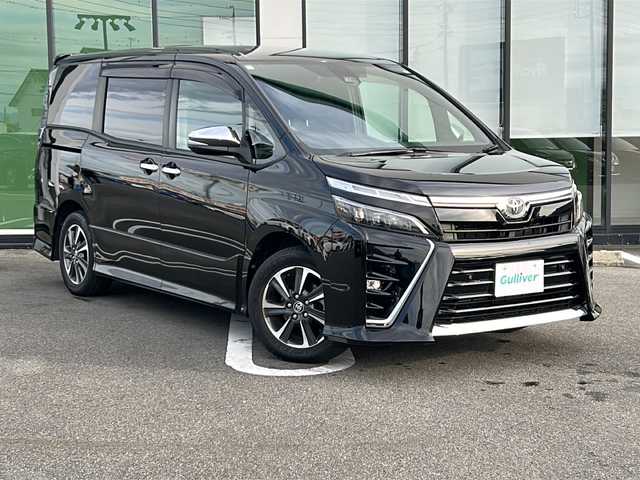 トヨタ ヴォクシー ZS 煌Ⅲ 岐阜県 2021(令3)年 5.9万km ブラック 登録時走行距離58312km/純正10インチナビ/フルセグＴＶ/バックカメラ/クルーズコントロール/両側パワースライドドア/コーナーセンサー/プッシュスタート/スマートキー/レーンキープアシスト/ＬＥＤヘッドライト/オートライト/禁煙車/ＥＴＣ/Bluetooth接続/純正アルミホイール/社外フロアマット/ハーフレザーシート/アイドリングストップ