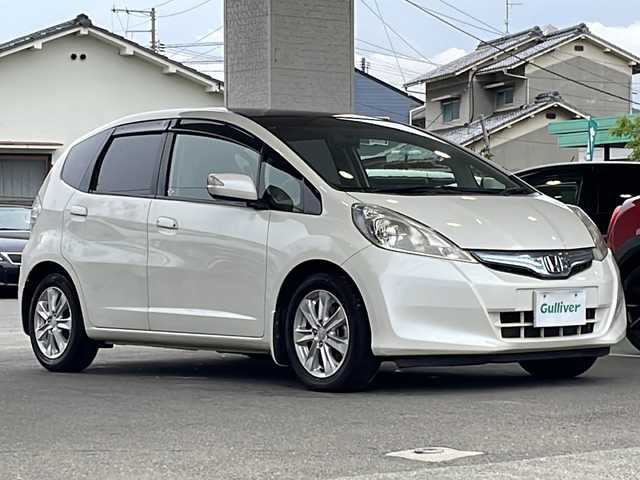 ホンダ フィット ハイブリット ナビ プレミアムセレクション 愛媛県 2011(平23)年 7.8万km プレミアムホワイトパール ワンオーナー/サンルーフ/・ガラスルーフ/HDDナビ/・ワンセグテレビ/・バックカメラ/・AM/FM/・CD/DVD/純正アルミホイール/ETC/スマートキー/ドアバイザー/ウィンカーミラー