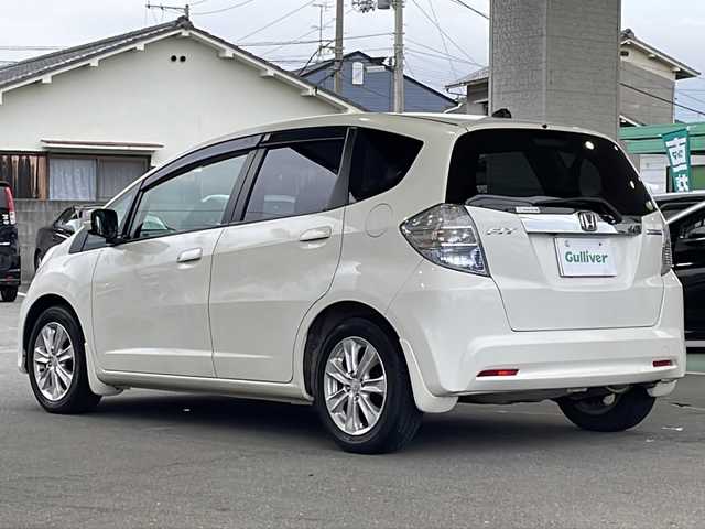 ホンダ フィット ハイブリット ナビ プレミアムセレクション 愛媛県 2011(平23)年 7.8万km プレミアムホワイトパール ワンオーナー/サンルーフ/・ガラスルーフ/HDDナビ/・ワンセグテレビ/・バックカメラ/・AM/FM/・CD/DVD/純正アルミホイール/ETC/スマートキー/ドアバイザー/ウィンカーミラー