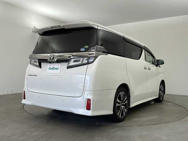 トヨタ ヴェルファイア Z Gエディション 兵庫県 2019(令1)年 6.8万km ホワイトパールクリスタルシャイン ・純正ナビ/Bluetooth/CD/DVD/TV/・バックカメラ/・Toyota Safety Sense/・プリクラッシュセーフティ/・レーントレーシングアシスト［LTA］/・レーダークルーズコントロール（全車速追従機能付）/・ロードサインアシスト［RSA］/・オートマチックハイビーム［AHB］/・先行車発進告知機能［TMN］/・インテリジェントクリアランスソナー/・ドライブスタートコントロール/・パワーバックドア/・電動パーキングブレーキ/・オートホールド/・ステアリングヒーター/・オートワイパー/・前席シートヒーター＆ベンチレーション/・前席パワーシート/・メモリシート/・オットマン/・ウインカーミラー/・自動防眩ミラー/・純正フロアマット/・LEDオートライト/・フォグランプ/・純正18インチアルミホイール/・ビルトインETC/・純正前方ドライブレコーダー/・取扱説明書/・スマートキー