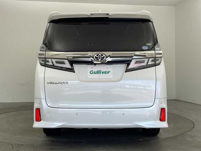 トヨタ ヴェルファイア Z Gエディション 兵庫県 2019(令1)年 6.8万km ホワイトパールクリスタルシャイン ・純正ナビ/Bluetooth/CD/DVD/TV/・バックカメラ/・Toyota Safety Sense/・プリクラッシュセーフティ/・レーントレーシングアシスト［LTA］/・レーダークルーズコントロール（全車速追従機能付）/・ロードサインアシスト［RSA］/・オートマチックハイビーム［AHB］/・先行車発進告知機能［TMN］/・インテリジェントクリアランスソナー/・ドライブスタートコントロール/・パワーバックドア/・電動パーキングブレーキ/・オートホールド/・ステアリングヒーター/・オートワイパー/・前席シートヒーター＆ベンチレーション/・前席パワーシート/・メモリシート/・オットマン/・ウインカーミラー/・自動防眩ミラー/・純正フロアマット/・LEDオートライト/・フォグランプ/・純正18インチアルミホイール/・ビルトインETC/・純正前方ドライブレコーダー/・取扱説明書/・スマートキー