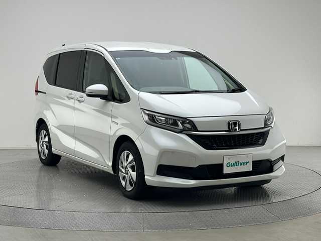 ホンダ フリード ハイブリット G ホンダセンシング 兵庫県 2020(令2)年 4.2万km プラチナホワイトパール 社外ナビ/パイオニア（AVIC-RZ８１０）/（フルセグ、CD、DVD、BT、MSV）/両側パワースライドドア/社外ドライブレコーダー（AG421‐DRC）/ビルトインETC/レーダークルーズコントロール/レーンキープアシスト/コーナーセンサー/PCS/標識認識/シートヒーター/ステアリングリモコン/LEDヘッドライト/オートライト