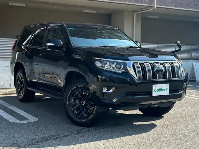 トヨタ ランドクルーザー プラド TX Lパッケージ 大阪府 2017(平29)年 8.6万km ブラック 【メーカーオプション】/チルト＆スライド電動ムーンルーフ（挟み込み防止機能付き）/【主要装備】/RAYS　17インチアルミホイール/BOSEスピーカー/KENWOODナビ/・バックカメラ　/・フルセグテレビ/・CD/DVD/・AM/FM/BT/デジタルインナーミラー（後付け）/本革シート/・パワーシート（運転席/助手席）/・シートヒーター/エアシート（運転席/助手席）/革巻きステアリング/・ステアリングスイッチ/LEDヘッドライト/フロントフォグランプ/【安全装備】/トヨタセーフティーセンス/・プリクラッシュセーフティ(歩行者[昼]検知機能付衝突回避支援タイプ/ミリ波レーダー+単眼カメラ方式)/・レーンディパーチャーアラート/・オートマチックハイビーム/・レーダークルーズコントロール(ブレーキ制御付)/SRSエアバッグ（ダブル+サイド+カーテン）/【その他装備・備品】/ETC/前後ドライブレコーダー/OBD　GUARD/保証書/取扱説明書/・記録簿（R７/R6/R5）