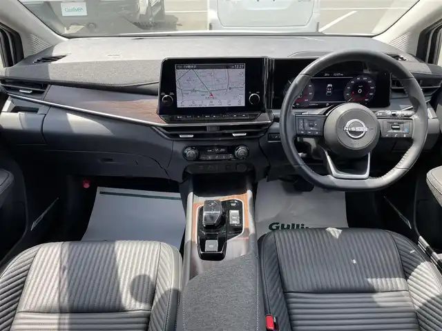 日産 オーラ G レザーエディション 茨城県 2022(令4)年 1.2万km ピュアホワイトパール 純正ナビ/【AM・FM・TV・BT・USB】/プロパイロット/レーダークルコン/ETC2.0/全方位カメラ/前後コーナーセンサー/ワイヤレス充電/ステリモ/ブレーキホールド/インテリジェントルームミラー/純正フロアマット/社外アルミホイール/オートライト/オートハイビーム/Fフォグ/LEDライト/ハンドル支援