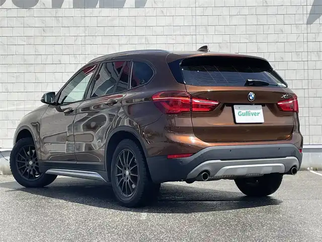 ＢＭＷ Ｘ１ xDrive 20i xライン ハイラインパッケージ 富山県 2015(平27)年 5.6万km 茶 4WD/サンルーフ/純正ナビ/Bluetooth/バックカメラ/衝突被害軽減ブレーキ/コーナーセンサー/レーンキープアシスト/レザーシート/ブラウンレザー調シートカバー/プッシュスタート/スマートキー/革巻きステアリング/シートヒーター/LEDヘッドライト/オートライト/ETC
