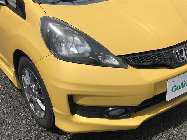 ホンダ フィット RS 富山県 2013(平25)年 8.3万km プレミアムイエローパールⅡ 6速MT/カーオーディオ/スマートキー/横滑り防止装置/革巻きステアリング/HIDヘッドライト/オートライト/電動格納ミラー/ウインカーミラー/フォグランプ/純正AWサマータイヤ車載/ETC