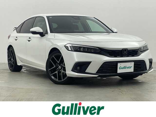 ホンダ シビック EX 群馬県 2021(令3)年 1.8万km プラチナホワイトパール ・MT車（６速マニュアル）/・禁煙車/・アクティブコーナリングライト/・純正９インチコネクトナビ/フルセグTV/AM/FM/Bluetooth/USB/スマホ連動/・BOSEサウンド/・ワイヤレス充電/・ホンダセンシング/衝突軽減ブレーキ/誤発進抑制機能/後方誤発進抑制機能/近距離衝突軽減ブレーキ/歩行者事故軽減ステアリング/路外逸脱抑制機能/渋滞追従機能付/BSM/・LEDライト/・ハーフレザーシート（D・Nパワーシート/シートヒーター）/・テールゲートスポイラー/・ETC2.0 /・ドラレコ/・無限フロアマット/＝＝＝＝＝/６速マニュアル　アクティブコーナリングライト　純正９インチコネクトナビ　ＢＯＳＥサウンド　ワイヤレス充電　ホンダセンシング　ＢＳＭ　ハーフレザーシート　ＥＴＣ２．０　ドラレコ　無限フロアマット　禁煙車