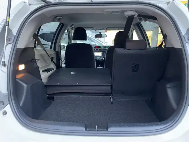 トヨタ アクア G 東京都 2013(平25)年 6.4万km ライムホワイトパールクリスタルシャイン モデリスタフルエアロ/大型リアスポイラー/ワンオーナー/純正メモリーナビ/　ワンセグTV/CD/Bluetooth/ETC/社外15インチアルミホイール/革巻きステアリングホイール/オートライト/プッシュスタート/ヘッドライトレベライザー/電動格納ミラー/ウインカーミラー/純正フロアマット/保証書/取扱説明書