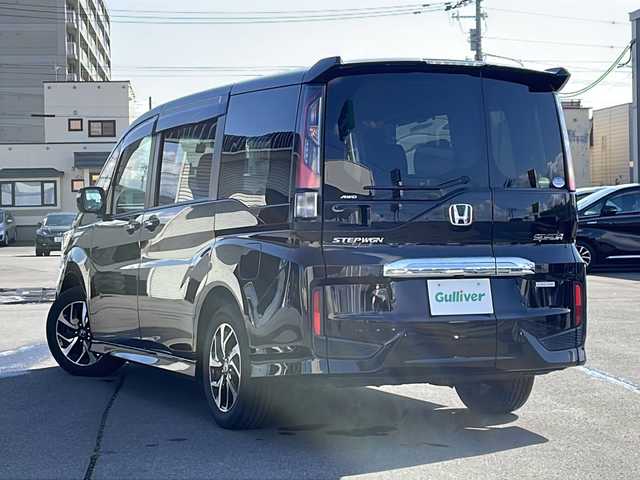 ホンダ ステップワゴン スパーダ ホンダセンシング 道北・旭川 2021(令3)年 3.1万km プレミアムスパークルブラックパール /寒冷地仕様//純正9インチナビ/　CD/DVD/BT/TV/USB/HDMI//バックカメラ//フリップダウンモニター//両側パワースライドドア//ホンダセンシング/　CMBS/ACC/LKAS/誤発信抑制装置/レーダークルーズコントロール//横滑り防止//ミラーヒーター//ビルトインETC//パドルシフト//前後ドライブレコーダー//LEDヘッドライト//LEDフォグランプ//革巻きステアリング//ステアリングリモコン//ドアバイザー//取扱説明書//保証書