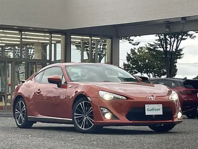 トヨタ ８６ GT リミテッド 宮城県 2015(平27)年 6.6万km オレンジメタリック 純正ナビ/バックカメラ/社外ルームミラー連動前後ドラレコ/ハーフレーザー/社外テレビキャンセラー/社外アルミスタッドレスタイヤ/プッシュスタート/横滑り防止スイッチ/電動格納ミラー