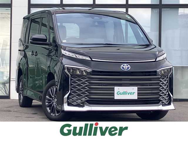 トヨタ ヴォクシー ハイブリッド S－Z 道央・札幌 2022(令4)年 2.7万km アティチュードブラックマイカ ワンオーナー/寒冷地仕様/純正10.5型ナビ/フルセグ/CD/DVD/BT/Miracast/USB/バックカメラ/両側パワースライド/パワーバックドア/ハーフレザーシート/衝突軽減ブレーキ/レーンキープアシスト/前後ドライブレコーダー/レーダークルーズコントロール/シートヒーター（D/N）/ステアリングヒーター/ワイパーデアイサー/オートマチックハイビーム/AC100V電源/コーナーセンサー/ＬＥＤヘッドライト/ヘッドライトレベライザー/ビルトインＥＴＣ/スマートキー×2/保証書/取扱説明書