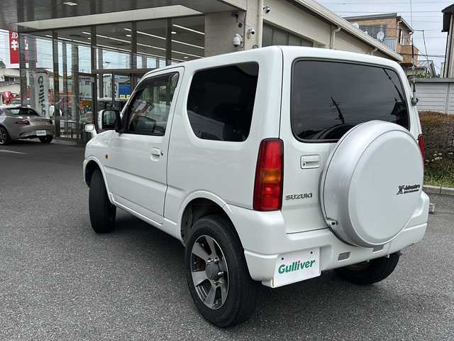 スズキ ジムニー クロスアドベンチャー XC 埼玉県 2011(平23)年 10.9万km パールホワイト メモリナビ/ワンセグテレビ/ウィンカーミラー/ETC/4WD/DVD機能再生有/16インチアルミホイール/背面タイヤ/運転席シートヒーター/ドライブレコーダー 有/Bluetooth/レーダー探知機 有(SUPER CAT)/運転席・助手席　エアバック有/本革巻きステアリング