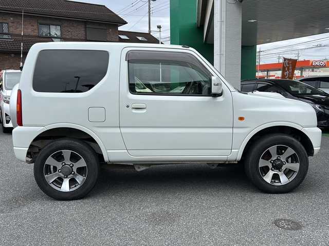 スズキ ジムニー クロスアドベンチャー XC 埼玉県 2011(平23)年 10.9万km パールホワイト メモリナビ/ワンセグテレビ/ウィンカーミラー/ETC/4WD/DVD機能再生有/16インチアルミホイール/背面タイヤ/運転席シートヒーター/ドライブレコーダー 有/Bluetooth/レーダー探知機 有(SUPER CAT)/運転席・助手席　エアバック有/本革巻きステアリング