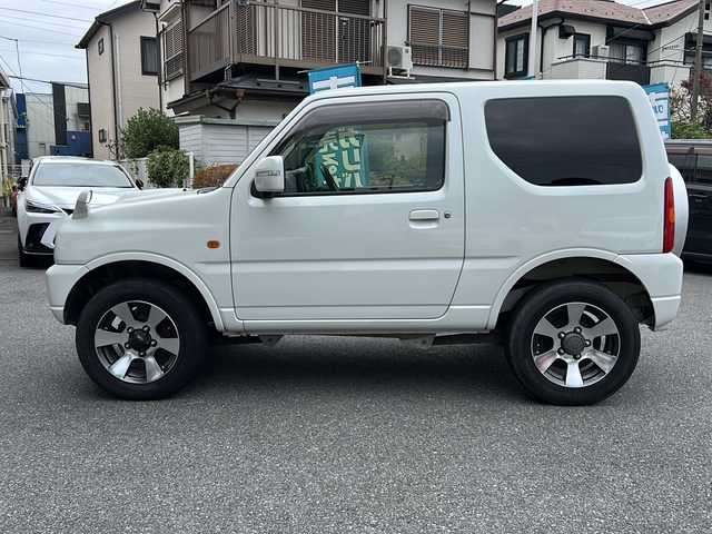 スズキ ジムニー クロスアドベンチャー XC 埼玉県 2011(平23)年 10.9万km パールホワイト メモリナビ/ワンセグテレビ/ウィンカーミラー/ETC/4WD/DVD機能再生有/16インチアルミホイール/背面タイヤ/運転席シートヒーター/ドライブレコーダー 有/Bluetooth/レーダー探知機 有(SUPER CAT)/運転席・助手席　エアバック有/本革巻きステアリング