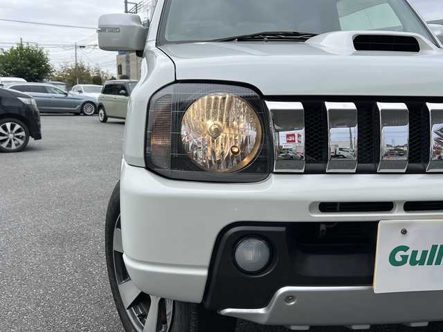 スズキ ジムニー クロスアドベンチャー XC 埼玉県 2011(平23)年 10.9万km パールホワイト メモリナビ/ワンセグテレビ/ウィンカーミラー/ETC/4WD/DVD機能再生有/16インチアルミホイール/背面タイヤ/運転席シートヒーター/ドライブレコーダー 有/Bluetooth/レーダー探知機 有(SUPER CAT)/運転席・助手席　エアバック有/本革巻きステアリング