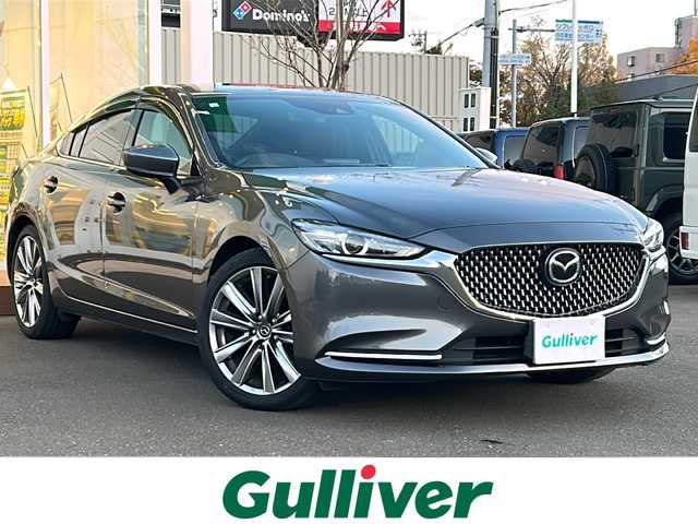 マツダ アテンザ セダン 25S Lパッケージ 道央・札幌 2019(平31)年 2.5万km マシーングレープレミアムM ・マツダコネクトナビ/・バックカメラ/・Bluetooth/・ワンセグTV/・DVD再生可能/・i　stop/・パーキングアシスト/・アイドリングストップ/・レーンキープアシスト/・コーナーセンサー/・ETC/・茶革シート/・シートヒーター/・エアシート/・パドルシフト/・純正19インチAW/・積込スタッドレス付き