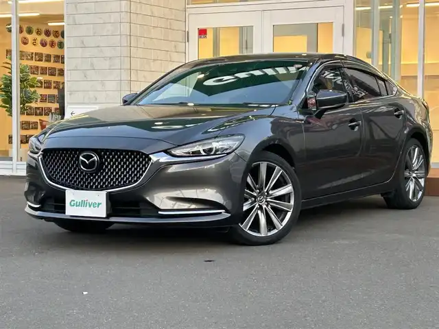 マツダ アテンザ セダン 25S Lパッケージ 道央・札幌 2019(平31)年 2.5万km マシーングレープレミアムM ・マツダコネクトナビ/・バックカメラ/・Bluetooth/・ワンセグTV/・DVD再生可能/・i　stop/・パーキングアシスト/・アイドリングストップ/・レーンキープアシスト/・コーナーセンサー/・ETC/・茶革シート/・シートヒーター/・エアシート/・パドルシフト/・純正19インチAW/・積込スタッドレス付き