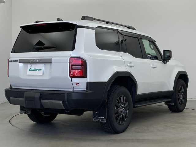 トヨタ ランドクルーザー ２５０ VX 新潟県 2025(令7)年 1.2万km プラチナホワイトパールマイカ 4WD/ワンオーナー/純正12.3型コネクティッドplusディスプレイオーディオ/（AM/FM/フルセグTV/Bluetooth/Miracast/HDMI）/JBLプレミアムサウンド/パノラミックビューモニター/ムーンルーフ/D席パワーシート/D+N席シートヒーター/シートベンチレーション/ステアリングヒーター/寒冷地仕様PWR HEAT/デジタルインナーミラー/Qi充電/パワーバックドア/トヨタセーフティセンス/・プリクラッシュセーフティ/・レーントレーシングアシスト/・レーンディパーチャーアラート/・レーダークルーズコントロール/・アダプティブハイビームシステム／オートマチックハイビーム/・ロードサインアシスト/・ドライバー異常時対応システム/・発進遅れ告知機能/トヨタチームメイト/Classioフロアマット/ブラックルーフレール/純正18インチAW