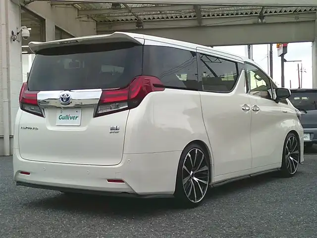 トヨタ アルファードハイブリット X 埼玉県 2015(平27)年 7.2万km ラグジュアリーホワイトパールクリスタルシャインガラスフレーク ・ディーラー記録簿（H27～R7まで完備）/・ワンオーナー/・サンルーフ/・両側パワースライドドア/・クルーズコントロール/・社外・デジタルインナーミラー（前後ドラレコ機能有）/・アルパイン10インチナビ/・アルパイン13インチフリップダウンモニター/・クラリオンフロントスピーカー/・クラリオンリアスピーカー/・カロッツェリア天吊りスピーカー/・アルパインアンプ/・社外・LEDルームランプ/・社外・皮調シートカバー/・社外・シフトゲートLEDイルミランプ/・2列目オットマンシート/・AC１００V電源/・社外・フルカラーLEDフットランプ/・社外・ルーフカラーイルミコントローラー/・TEIN車高調（フレックスZ)/・ロクサーニメイオール21インチアルミ/（９．０J　＋３８）/・コンチネンタルマックスコンタクトタイヤ21インチ/・HIDヘッドライト/・HIDフォグランプ/・社外・スーパーウェルカムライティングキット/・社外・アイドリングライトキット/・社外・アルミスカッフプレート/・社外・ホーン（クラクソンストリトーン）/・スマートキー×２/・プッシュスタート/・保証書/・取説