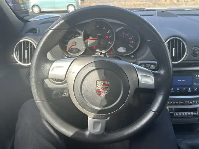ポルシェ ボクスター 千葉県 2007(平19)年 5万km アトラスグレー 左ハンドル/5速MT/オープンカー/社外ディスプレイオーディオ/・AM/FM/BT/ビルトインETC/シートヒーター（D+N席）/純正フロアマット/アンチロック・ブレーキ・システム/純正17インチアルミホイール/エアバッグ（W+サイド）/保証書/扱説明書