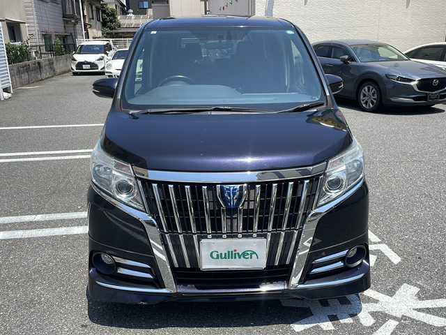トヨタ エスクァイア ハイブリッド Xi 広島県 2015(平27)年 10.6万km スパークリングブラックパールクリスタルシャイン /登録時走行距離/　　　　　　　105699キロ/社外ナビ/バックカメラ/地デジ/左後パワースライドドア/社外フリップダウンモニター/　　【PCX-RM3505】/シートヒーター/ビルトインETC/新車時整備手帳/　　【保証書】/取扱説明書/