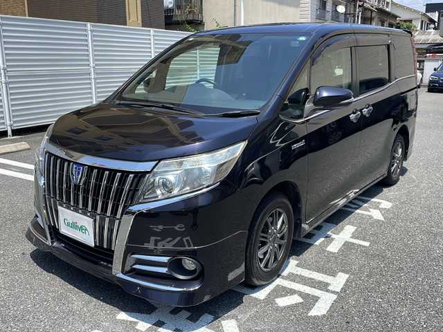 トヨタ エスクァイア ハイブリッド Xi 広島県 2015(平27)年 10.6万km スパークリングブラックパールクリスタルシャイン /登録時走行距離/　　　　　　　105699キロ/社外ナビ/バックカメラ/地デジ/左後パワースライドドア/社外フリップダウンモニター/　　【PCX-RM3505】/シートヒーター/ビルトインETC/新車時整備手帳/　　【保証書】/取扱説明書/