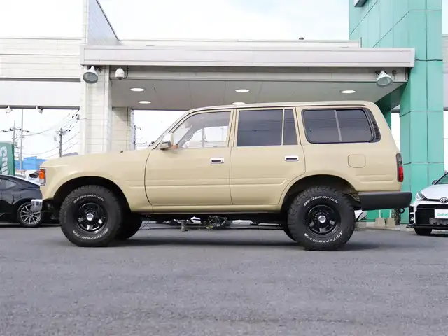 トヨタ ランドクルーザー VX－LTD 神奈川県 1994(平6)年 13.6万km ベージュ 60フェイス（色替え）/リフトアップ/ナローボディ/1ナンバー登録/BF Goodrich All-terrain/：235/85R16（ホワイトレター）/PROUD HORN/社外ウッドステアリング/サンルーフ/メモリナビ/：フルセグTV/：CD DVD再生/：Bluetoothオーディオ/：バックカメラ/社外フロアマット/純正キー/：リモコン有り/ETC/ドラレコ（フロント）/社外シートカバー/ーーーーーーーーーーーーーーーーーーー/取扱説明書