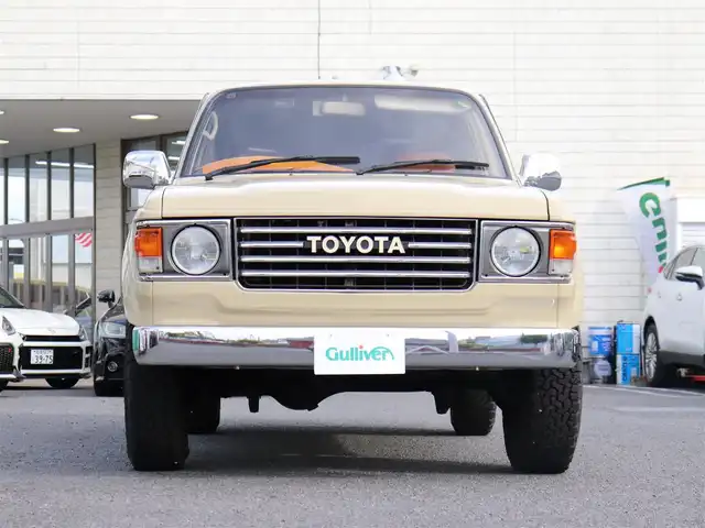 トヨタ ランドクルーザー VX－LTD 神奈川県 1994(平6)年 13.6万km ベージュ 60フェイス（色替え）/リフトアップ/ナローボディ/1ナンバー登録/BF Goodrich All-terrain/：235/85R16（ホワイトレター）/PROUD HORN/社外ウッドステアリング/サンルーフ/メモリナビ/：フルセグTV/：CD DVD再生/：Bluetoothオーディオ/：バックカメラ/社外フロアマット/純正キー/：リモコン有り/ETC/ドラレコ（フロント）/社外シートカバー/ーーーーーーーーーーーーーーーーーーー/取扱説明書