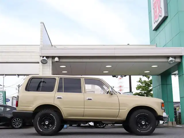 トヨタ ランドクルーザー VX－LTD 神奈川県 1994(平6)年 13.6万km ベージュ 60フェイス（色替え）/リフトアップ/ナローボディ/1ナンバー登録/BF Goodrich All-terrain/：235/85R16（ホワイトレター）/PROUD HORN/社外ウッドステアリング/サンルーフ/メモリナビ/：フルセグTV/：CD DVD再生/：Bluetoothオーディオ/：バックカメラ/社外フロアマット/純正キー/：リモコン有り/ETC/ドラレコ（フロント）/社外シートカバー/ーーーーーーーーーーーーーーーーーーー/取扱説明書