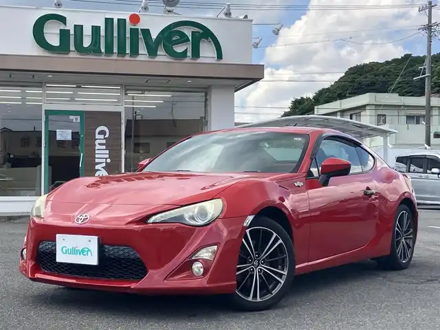 トヨタ ８６ GT 三重県 2013(平25)年 9.7万km ライトニングレッド 柿本２本出しマフラー/サブウーハー(カロッツェリア)　/♪社外SDナビ　/　・Bluetooth・SD録音/　・フルセグ・CD/DVD再生/♪バックカメラ/♪スマートキー/♪プッシュスタート/♪HIDヘッドライト/♪フォグライト /♪オートライト/♪スロットコントローラー/♪純正17インチAW/♪革巻ステアリング/♪パドルシフト/♪社外シフトノブ(純正あり)/♪フロアマット/♪ドアバイザー/♪横滑り防止機能/♪ライトレベリング/♪サイド/カーテンエアバック