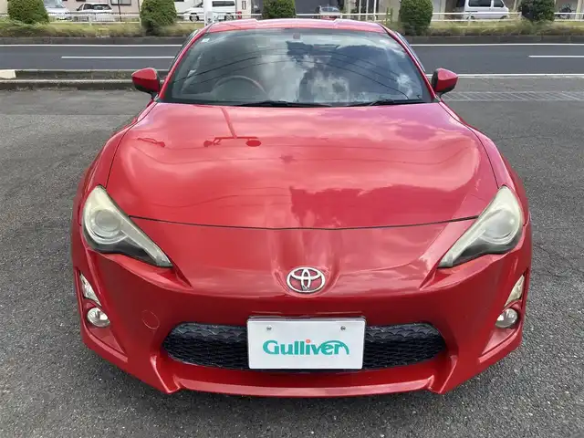 トヨタ ８６ GT 三重県 2013(平25)年 9.7万km ライトニングレッド 柿本２本出しマフラー/サブウーハー(カロッツェリア)　/♪社外SDナビ　/　・Bluetooth・SD録音/　・フルセグ・CD/DVD再生/♪バックカメラ/♪スマートキー/♪プッシュスタート/♪HIDヘッドライト/♪フォグライト /♪オートライト/♪スロットコントローラー/♪純正17インチAW/♪革巻ステアリング/♪パドルシフト/♪社外シフトノブ(純正あり)/♪フロアマット/♪ドアバイザー/♪横滑り防止機能/♪ライトレベリング/♪サイド/カーテンエアバック