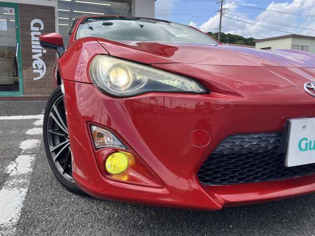 トヨタ ８６ GT 三重県 2013(平25)年 9.7万km ライトニングレッド 柿本２本出しマフラー/サブウーハー(カロッツェリア)　/♪社外SDナビ　/　・Bluetooth・SD録音/　・フルセグ・CD/DVD再生/♪バックカメラ/♪スマートキー/♪プッシュスタート/♪HIDヘッドライト/♪フォグライト /♪オートライト/♪スロットコントローラー/♪純正17インチAW/♪革巻ステアリング/♪パドルシフト/♪社外シフトノブ(純正あり)/♪フロアマット/♪ドアバイザー/♪横滑り防止機能/♪ライトレベリング/♪サイド/カーテンエアバック