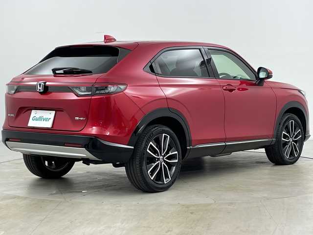 ホンダ ヴェゼル ハイブリッド e:HEV Z 道央・札幌 2021(令3)年 1.2万km プレミアムクリスタルレッドM ・4WD/・寒冷地仕様/・純正ナビ&BT&TV&USB/・バックカメラ/・パワーバックドア/・Honda　SENSING/・レーダークルーズコントロール/・ブラインドスポットモニター/・ハーフレザー/・前席シートヒーター/・ステアリングヒーター/・ドアミラーヒーター/・ビルトインETC2.0/・ワイヤレス充電/・LEDヘッドライト/・オートライト/・スマートキー/・スペアキー/・純正18インチAW/・純正AW付スタッドレス積載