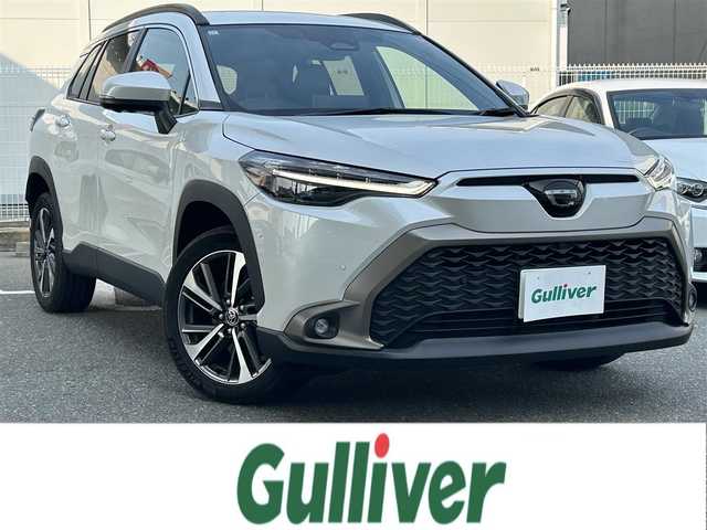 トヨタ カローラ クロス ハイブリッド Z 福岡県 2023(令5)年 1.7万km パール ワンオーナー/純正メーカーナビ（AM/FM/BT/フルセグTV）/運転席パワーシート/ブラインドスポットモニター/前席シートヒーター/バックカメラ/アラウンドビューモニター/ルーフレール/ETC2.0/前後ドライブレコーダー/電動リアゲート/クリアランスソナー/RCTA（リヤクロストラフィックアラート）/RSA（ロードサインアシスト）/PDA（プロアクティブドライビングアシスト）/オートライト/オートマチックハイビーム/純正18インチアルミホイール/社外フロアマット（clazzio)/スペアキー×１/保証書/取扱説明書