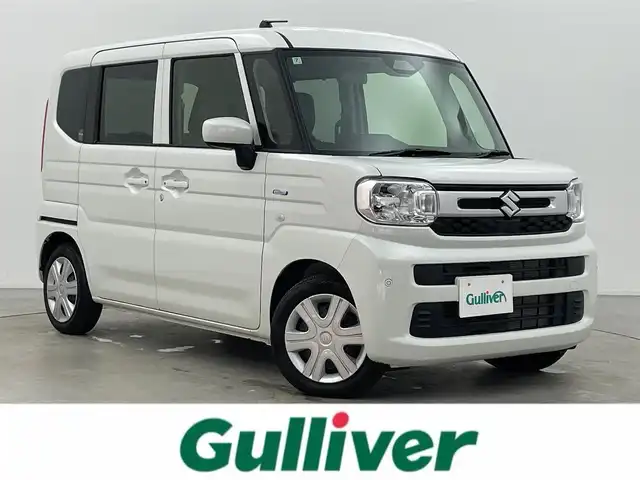 スズキ スペーシア HYBRID X 富山県 2024(令6)年 0.4万km ピュアホワイトP 社外ナビ（AM/FM/CD/BT/フルセグ）/両側パワースライドドア/シートヒーター/衝突被害軽減システム/レーンキープアシスト/コーナーセンサー/横滑り防止装置/アイドリングストップ/社外フロアマット/オートLEDライト/リアサーキュレーター/スマートキー/スペアキー
