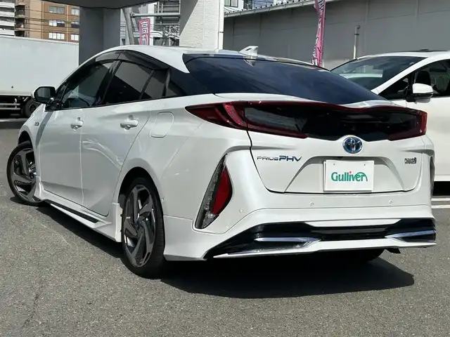 トヨタ プリウス ＰＨＶ A プレミアム 福岡県 2021(令3)年 3.9万km プラチナホワイトパールマイカ 純正メーカーディスプレイオーディオ/（ナビ・フルセグTV・Bluetooth）/JBLプレミアムサウンド/パノラミックビューモニター/トヨタセーフティセンス/シートヒーター/シートクーラー/運転席パワーシート/ブラインドスポットモニター/ワイヤレス充電器/ハンドルヒーター/パーキングアシスト/モデリスタフルエアロ/モデリスタアルミ18インチ/2.0ビルトインETC/ウィンカーミラー/ドアバイザー/純正フロアマット/取扱説明書