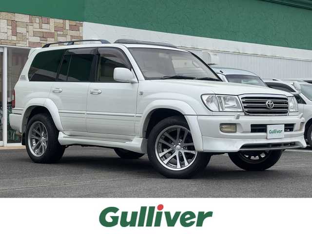 トヨタ ランドクルーザー VX－LTD Gセレクション 徳島県 2003(平15)年 19.1万km ホワイトパールクリスタルシャイン メーカー純正ナビゲーション/（ラジオ/CD/MD/CDチェンジャー）/サンルーフ　/フロントスポイラー/サイドエアロカバー/２０インチ社外アルミホイール/ＨＩＤヘッドライト　/フォグランプ　/ヘッドライトウォッシャー/車高調整エアサスペンション/リヤフォグランプ/クルーズコントロール/社外フロント＆リヤモニター/ＥＴＣ　/ウッドコンビハンドル　/レザーシート　/両席パワーシート　/オールオートパワーウインドウ/電動格納ミラー/リヤワイパー/ワイヤレスキー/純正フロアマット　/サイドバイザー