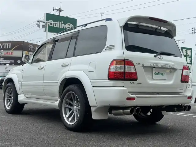 トヨタ ランドクルーザー VX－LTD Gセレクション 徳島県 2003(平15)年 19.1万km ホワイトパールクリスタルシャイン メーカー純正ナビゲーション/（ラジオ/CD/MD/CDチェンジャー）/サンルーフ　/フロントスポイラー/サイドエアロカバー/２０インチ社外アルミホイール/ＨＩＤヘッドライト　/フォグランプ　/ヘッドライトウォッシャー/車高調整エアサスペンション/リヤフォグランプ/クルーズコントロール/社外フロント＆リヤモニター/ＥＴＣ　/ウッドコンビハンドル　/レザーシート　/両席パワーシート　/オールオートパワーウインドウ/電動格納ミラー/リヤワイパー/ワイヤレスキー/純正フロアマット　/サイドバイザー