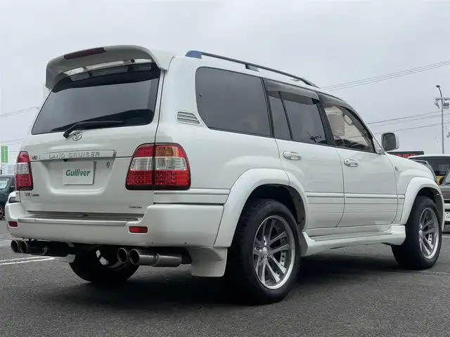 トヨタ ランドクルーザー VX－LTD Gセレクション 徳島県 2003(平15)年 19.1万km ホワイトパールクリスタルシャイン メーカー純正ナビゲーション/（ラジオ/CD/MD/CDチェンジャー）/サンルーフ　/フロントスポイラー/サイドエアロカバー/２０インチ社外アルミホイール/ＨＩＤヘッドライト　/フォグランプ　/ヘッドライトウォッシャー/車高調整エアサスペンション/リヤフォグランプ/クルーズコントロール/社外フロント＆リヤモニター/ＥＴＣ　/ウッドコンビハンドル　/レザーシート　/両席パワーシート　/オールオートパワーウインドウ/電動格納ミラー/リヤワイパー/ワイヤレスキー/純正フロアマット　/サイドバイザー