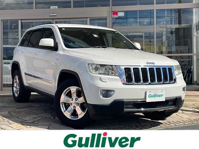 クライスラー・ジープ ジープ グランドチェロキー LTD 静岡県 2011(平23)年 9.8万km 白 社外ナビ/・デジタルTV/・HDD MUSIC/・CD/DVD/・FM/AM/・SD動画/音楽/・Bluetooth/・ハンズフリー通話/主要装備/・４WD/・バックカメラ/・パワーシート（D席＋N席）/・クルーズコントロール/・ダウンヒルアシストコントロール/・ETC/・サイドカーテンエアバッグ/・オートライト/・左右独立温度調整ＡＡＣ/・横滑り防止装置/・ＨＩＤライト/・走行モード切替/・ステアリングスイッチ