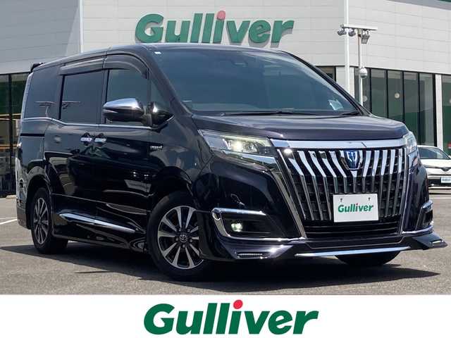 トヨタ エスクァイア ハイブリッド Gi プレミアムパッケージ 佐賀県 2018(平30)年 6.1万km スパークリングブラックパールクリスタルシャイン ALPINE１１インチナビ/フルセグTV/CD/DVD/Bluetooth/USB/バックモニター/12.1インチ後席モニター/プリクラッシュセーフティ/前席シートヒーター/シートカバー付き/両側パワースライドドア/クルーズコントロール/レーンキープアシスト/アイドリングストップ/オートマチックハイビーム/ドライブレコーダー/プッシュスタート/スマートキー/ＥＴＣ/ＬＥＤライト/エアロパーツ/純正アルミホイール