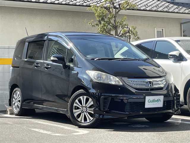 ホンダ フリード ハイブリット ジャストセレクション 福島県 2012(平24)年 8.9万km プレミアムブラキッシュパール 純正HDDナビ/CD、DVD、MSV、ワンセグTV/ハーフレザーシート/クルーズコントロール/前後録画ドライブレコーダー/バックカメラ/ビルトインETC/ステアリングリモコン/スマートキー/両側パワースライドドア/オートライト/キセノンライト/純正15インチアルミホイール/・社外アルミ付き夏タイヤ積み込み/保証書/取扱説明書