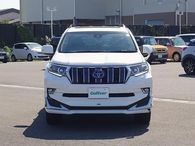 トヨタ ランドクルーザー プラド TX Lパッケージ 山形県 2022(令4)年 2.7万km ホワイトパールクリスタルシャイン ワンオーナー車/4WD/サンルーフ/7人乗り/MODELLISTAエアロ/セーフティセンス/レザーシート/パワーシート/シートヒーター/エアシート/横滑り防止装置/純正オーディオ/　【CD USB AUX】/コーナーセンサー/LEDライト/フォグランプ/ウィンカーミラー/純正フロアマット/純正ドアバイザー/保証書、取説あり