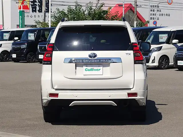 トヨタ ランドクルーザー プラド TX Lパッケージ 山形県 2022(令4)年 2.7万km ホワイトパールクリスタルシャイン ワンオーナー車/4WD/サンルーフ/7人乗り/MODELLISTAエアロ/セーフティセンス/レザーシート/パワーシート/シートヒーター/エアシート/横滑り防止装置/純正オーディオ/　【CD USB AUX】/コーナーセンサー/LEDライト/フォグランプ/ウィンカーミラー/純正フロアマット/純正ドアバイザー/保証書、取説あり